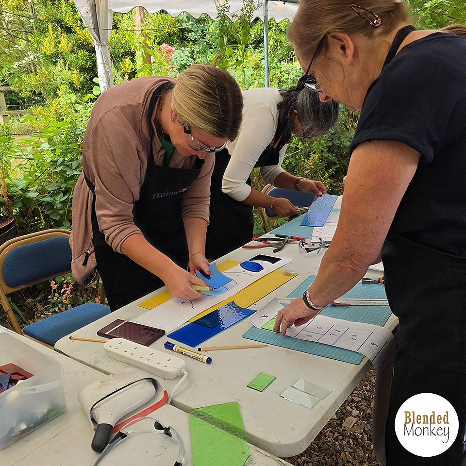 Leaded glass panel group enjoying the creative process