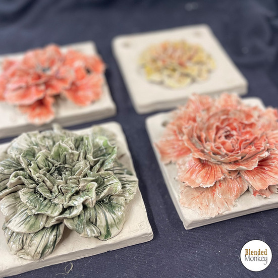 Clay blossom tiles created during a sculpture workshop at Blended Monkey