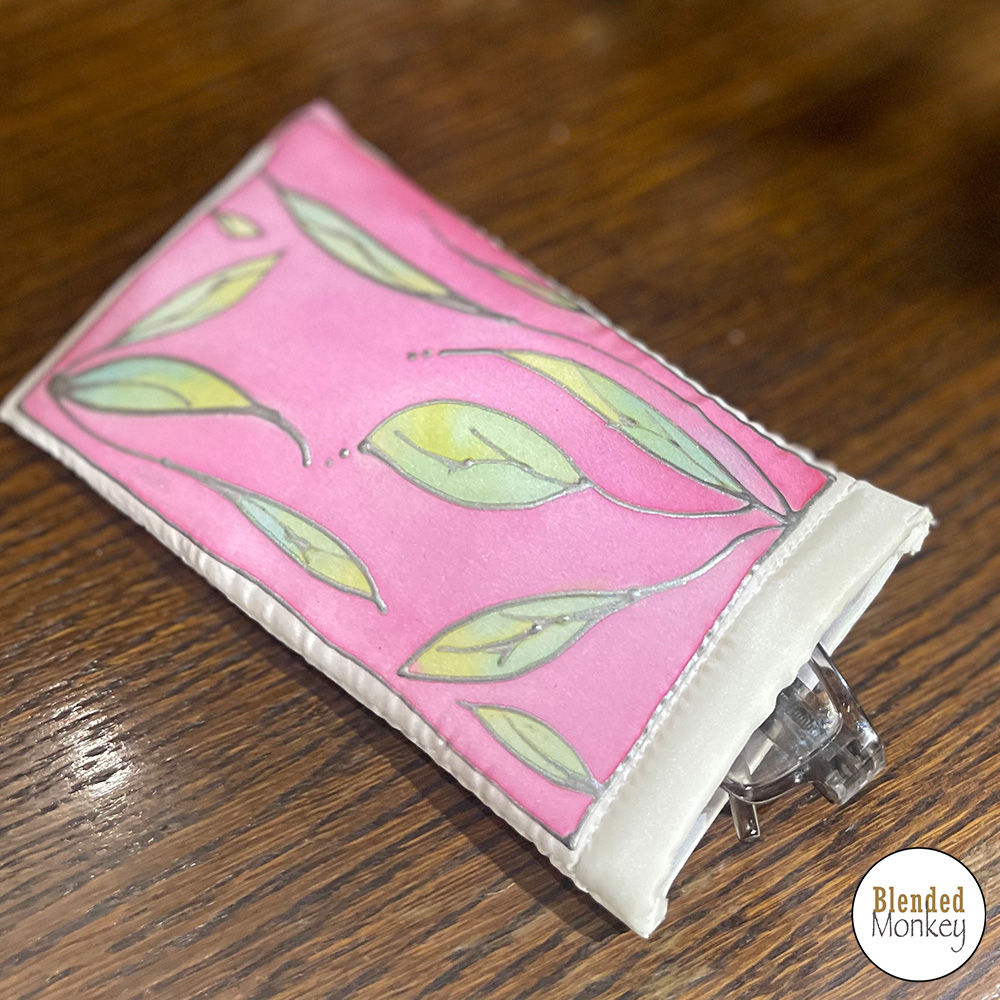 Silk glasses case that has been painted in a unique leaf design