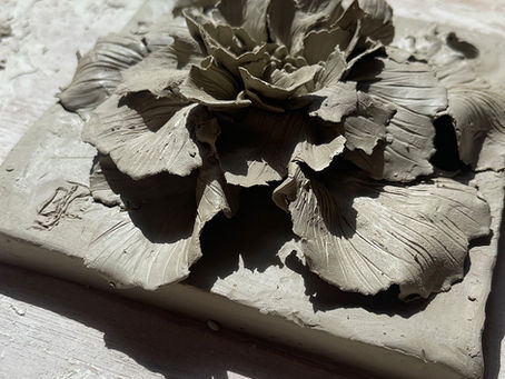 One of the clay blossom tile sculptures created in this morning's workshop here in the Blended Monkey Studios