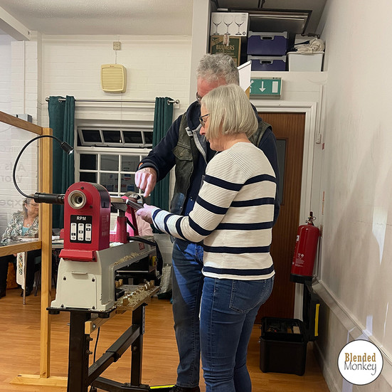 Member of the Haddenham WI having a go at woodturning