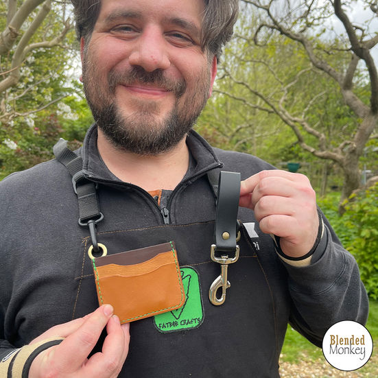 Student happy with his handmade leather card case and belt loop