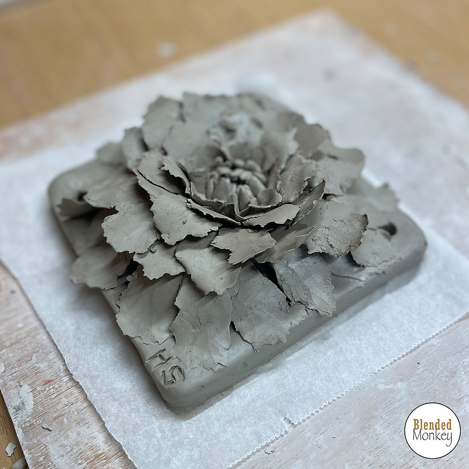 Group shot of our clay blossom tile students here in the Blended Monkey Studios