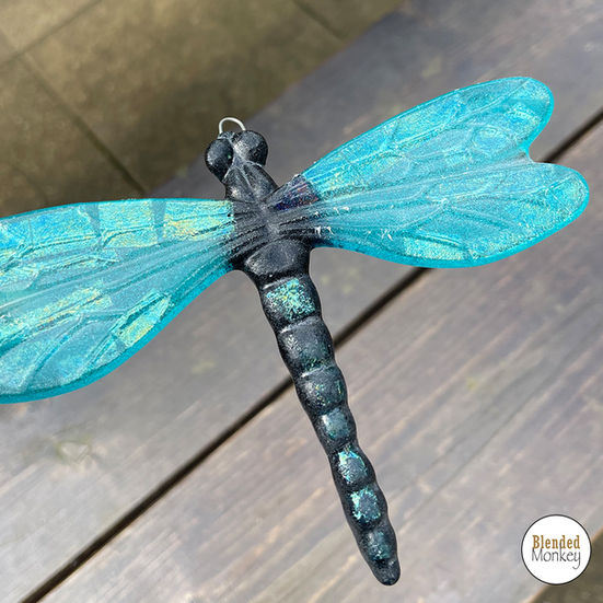 Beautiful turquoise fused glass dragonfly made at our Blended Monkey fused glass workshop