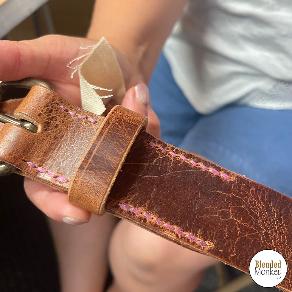 Belt with pink stitching made by one of the students in today's leatherwork experience