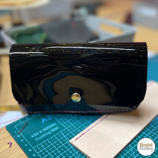 Glossy black leather pouch