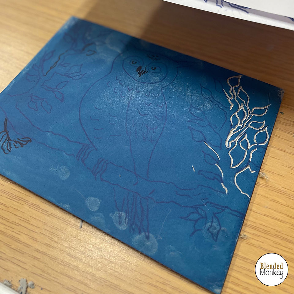 Inking up the lino before cutting so you can see your marks