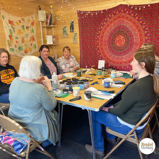 Students doing a fused glass workshop with Blended Monkey