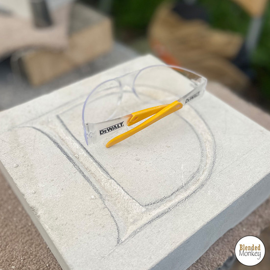 Laying out a capital "D" on a piece of Portland stone