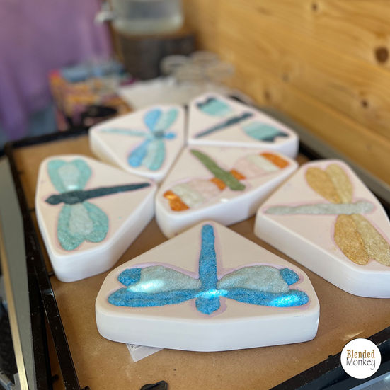 Dragonfly moulds filled with glass frit