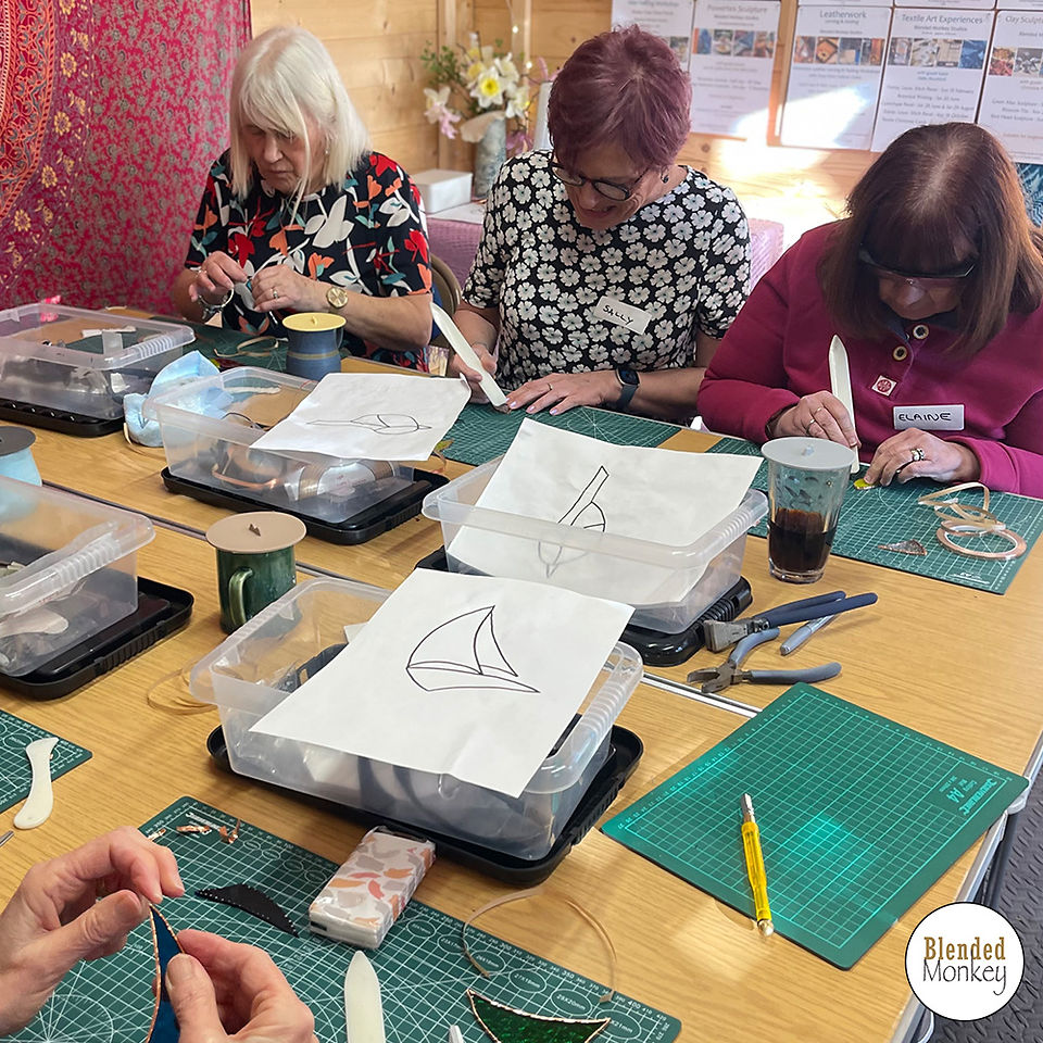 Group of students enjoying their copper foiling experience here in the Blended Monkey Studios