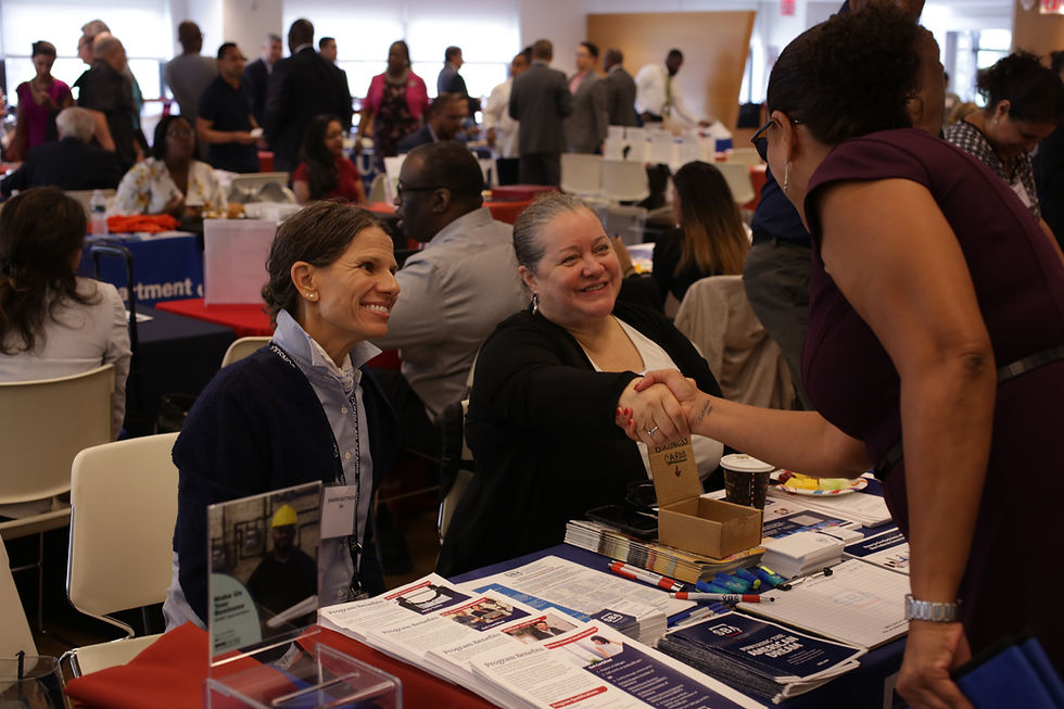 Busines women shaking hands at a careerfair