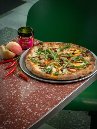 Emmer Pizza touches down at Hong Kong International Airport and turns up the heat with the Peaches & Scream Pizza