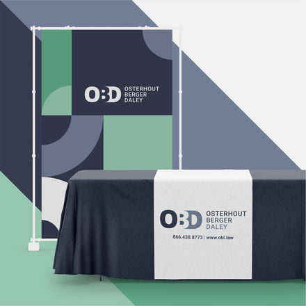 a table with a table runner that says osterhout berger daley