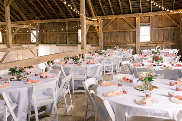 Barn wedding reception with pink accents