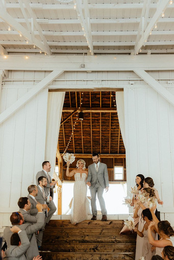 grand entrance into white barn wedding venue