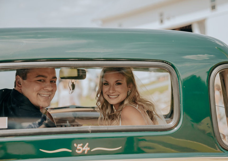 Bride and groom in a car