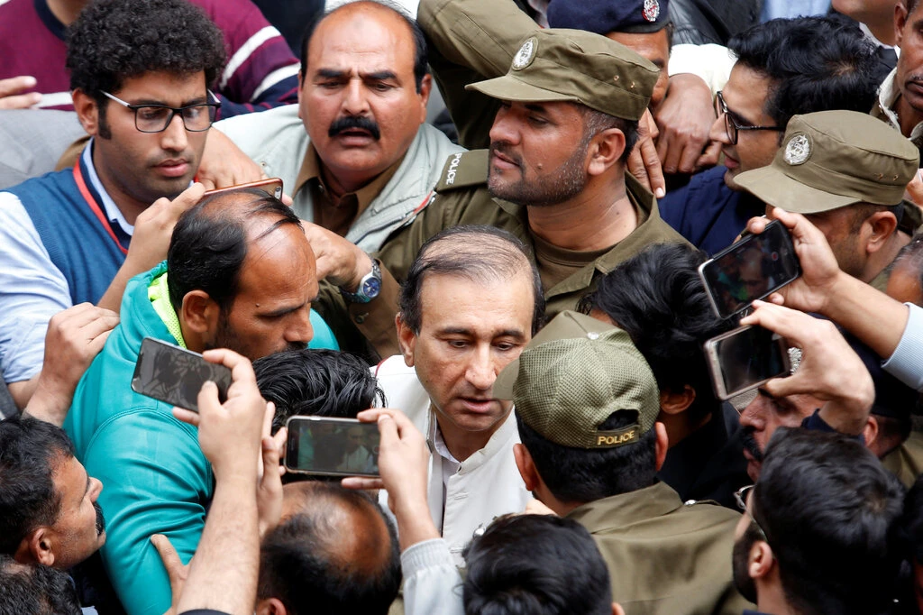 Mir Shakil-ur-Rehman, center, the owner of Jang media group, which operates a TV station and newspapers critical of the government, has been detained without charges for more than 100 days. Credit...Reuters