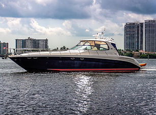 A luxurious 55 Azimut yacht floating serenely on crystal-clear waters, showcasing its sleek design, expansive sun deck, and e