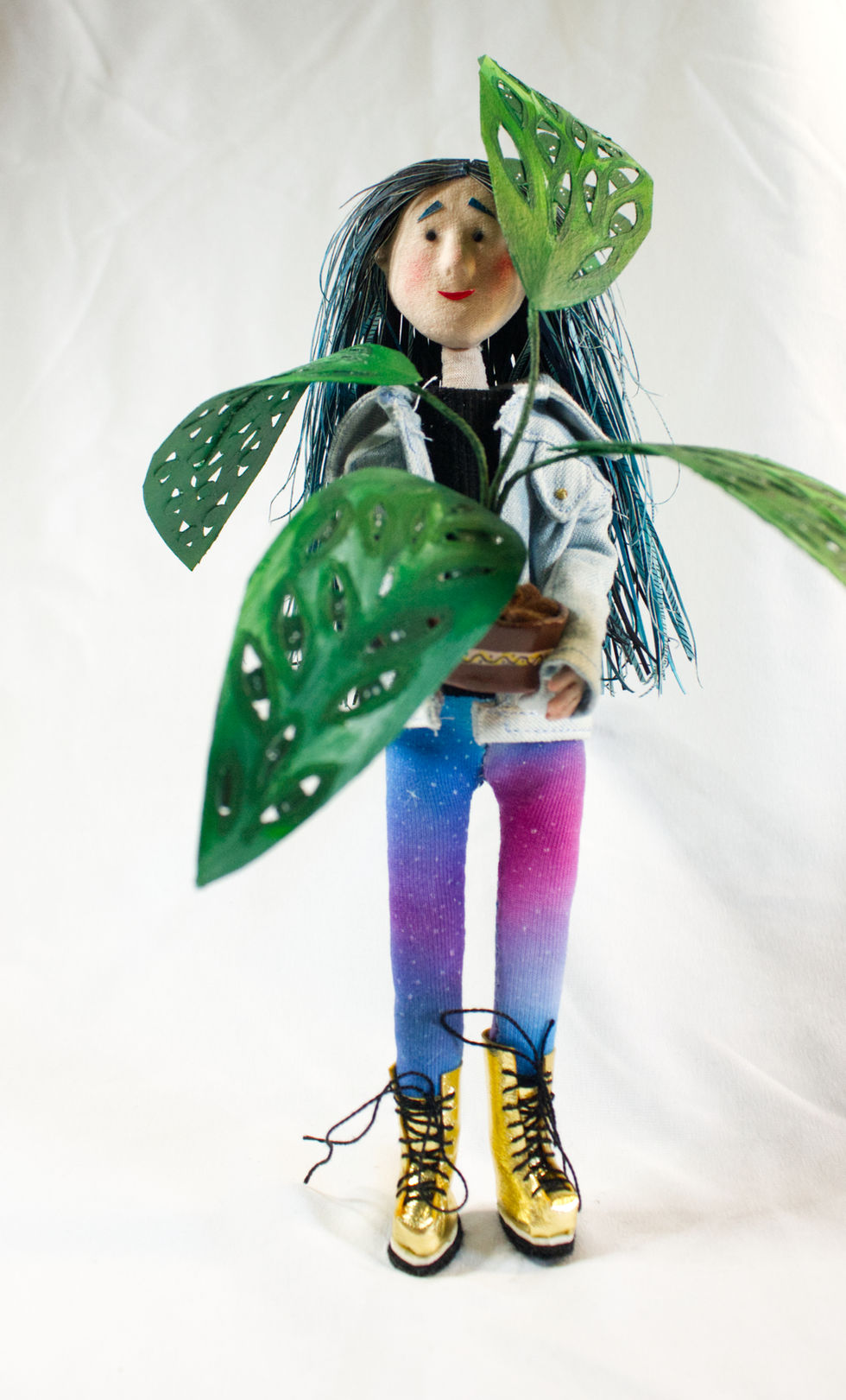 Textile and mixed-media artwork showing Fille Intense with her emotional plants in a poetic composition