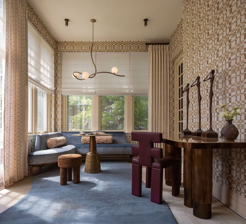 Kuchar transformed this sunroom through thoughtful space planning, layered textures, and a natural color palette, resulting in a multi-use space that transitions effortlessly from day to night.