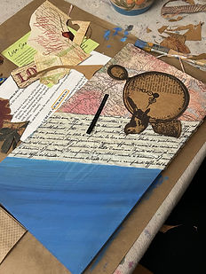 Layered artwork featuring a clock with perched birds, cursive handwriting, and a blue-painted section resembling water or sky.