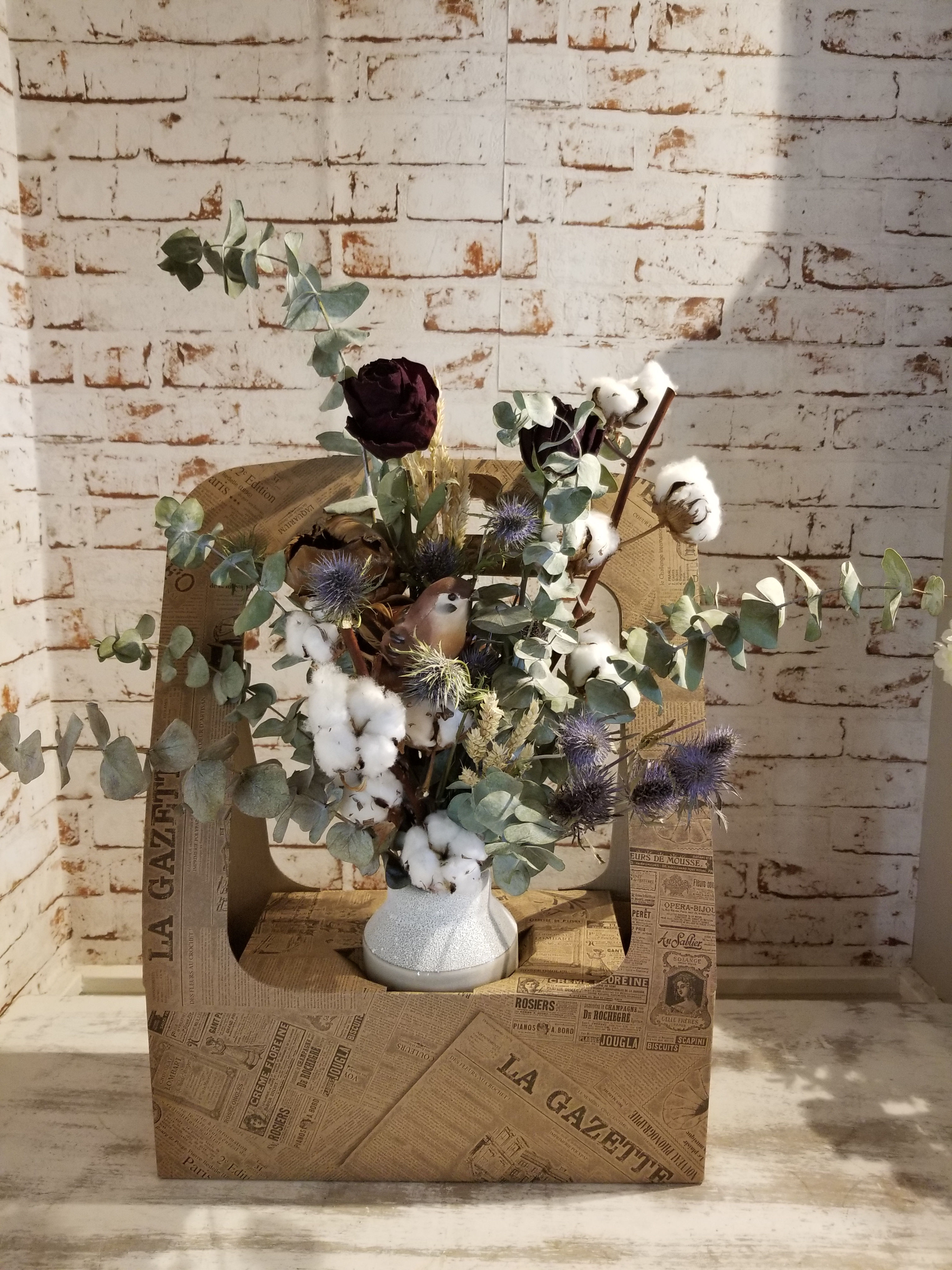 Montage de fleurs séché en boite.