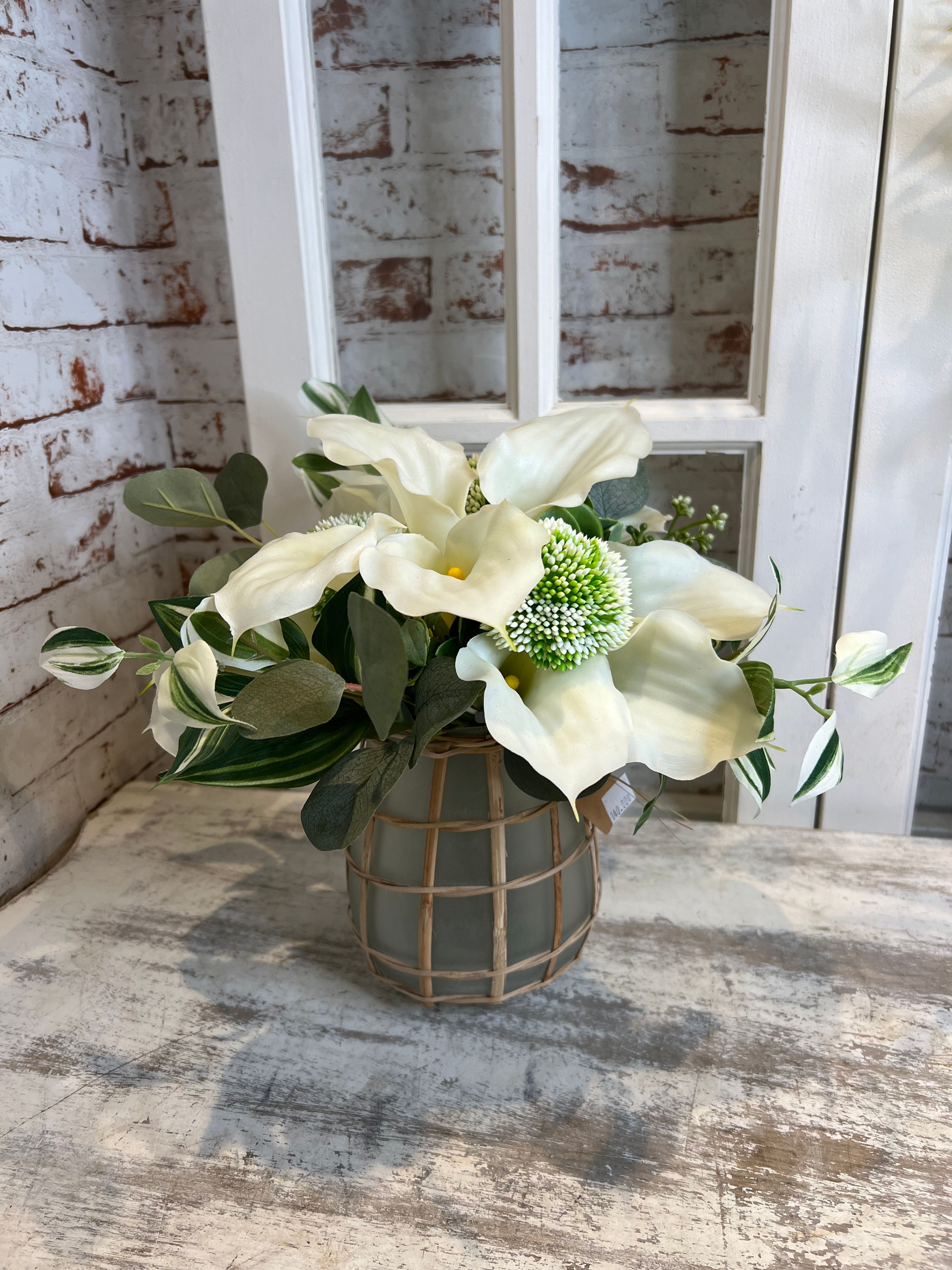 Bouquet de callas en vase.