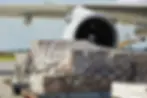 Large cargo pallets about to be loaded inside a cargo aircraft