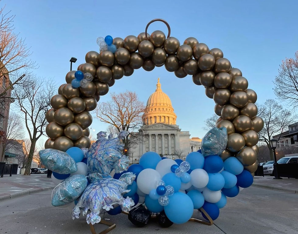 Gold themed balloon circle with snowflakes at the Wisconsin State Capitol.