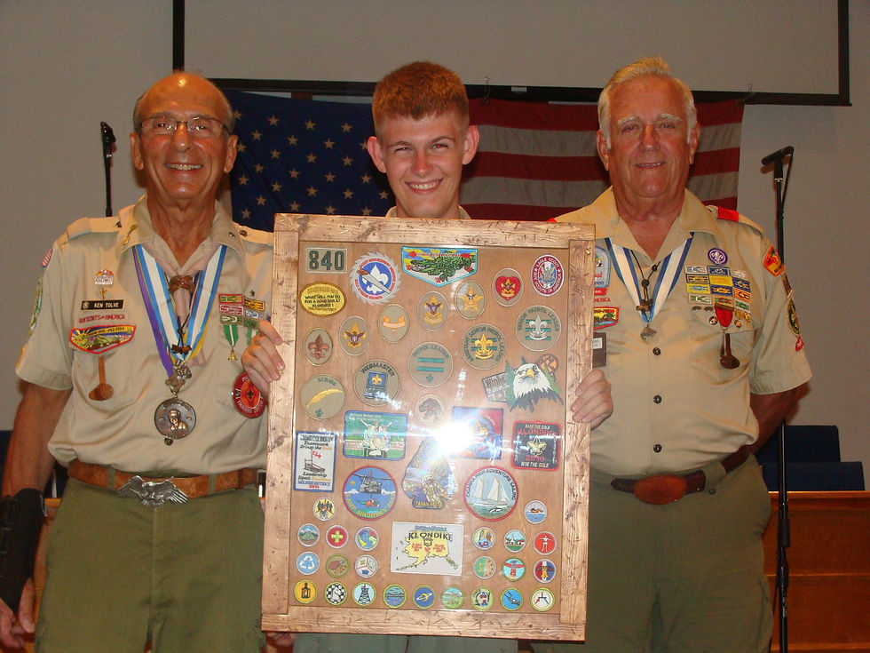 Low-angle view of Eagle Scout medals resting on a wooden ceremony table