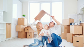 Family in New Home Boxes.jpeg