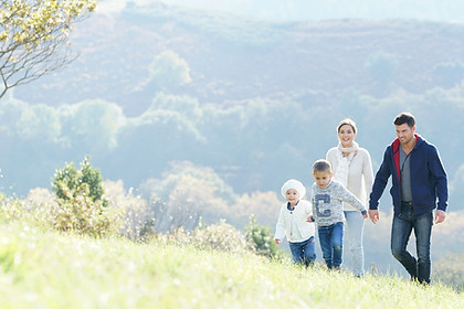 Happy family walking in countrysid.jpeg