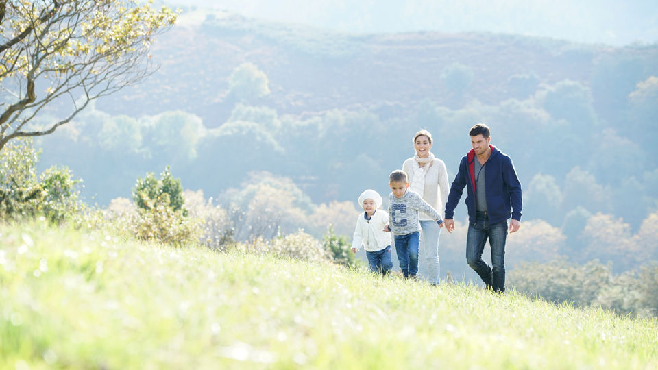 Happy family walking in countrysid.jpeg