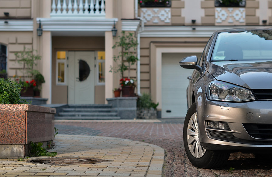 car parked background house.jpeg