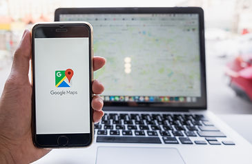 photo of phone and laptop with maps app