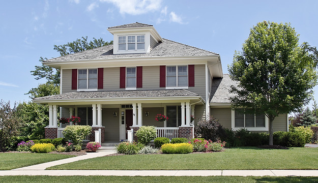 Suburban home with red shutters.jpeg