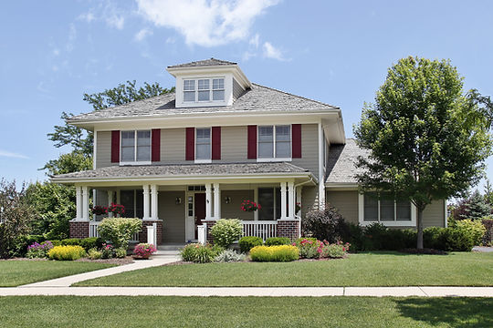 Suburban home with red shutters.jpeg