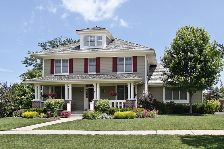 Suburban home with red shutters.jpeg