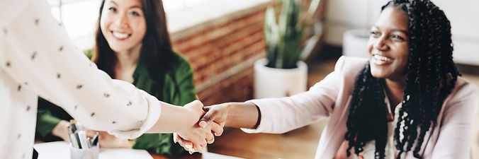 Happy businesswomen handshake.jpeg
