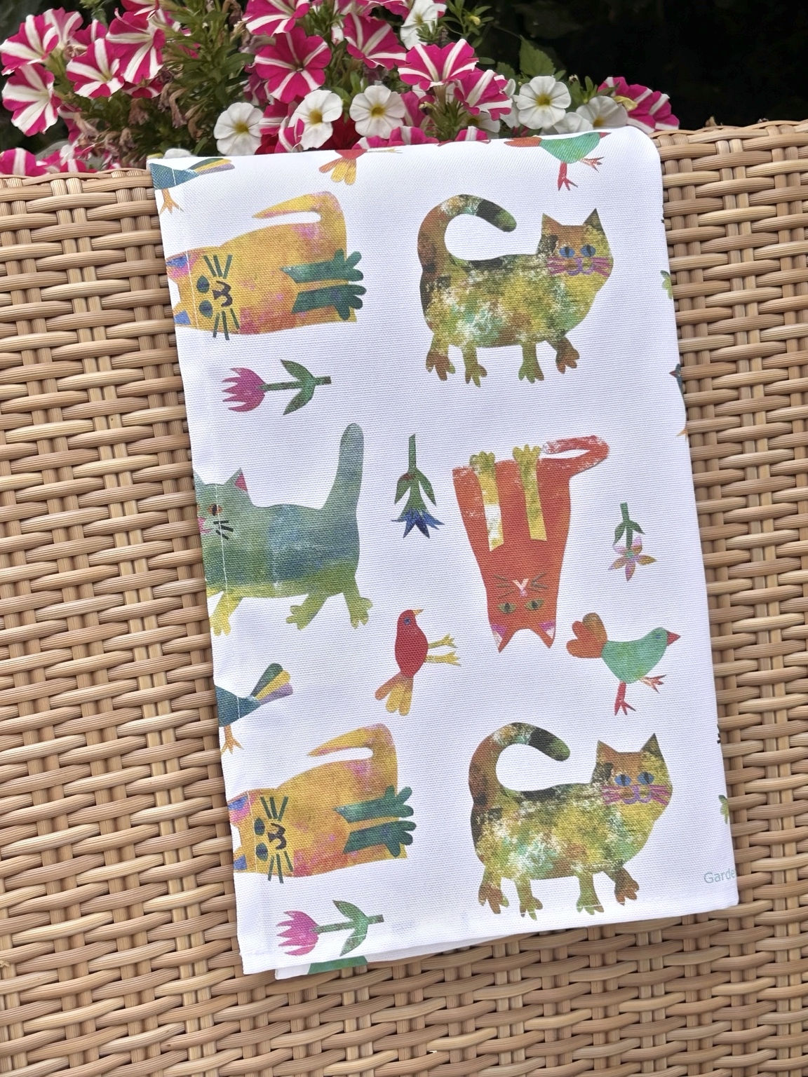colourful cats in garden tea towel by Katrin Eagle
