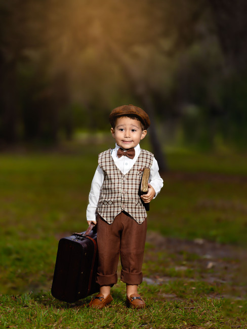 Portrait of a young boy with a vintage style outfit captured at Lake Mills Park.