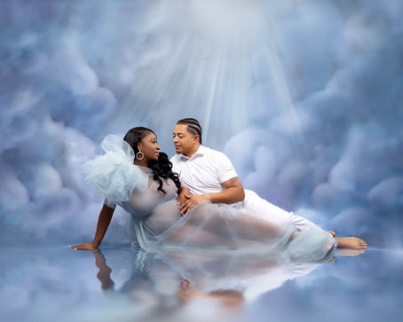 Couple posing in a heaven-inspired maternity photography session in Orlando, FL
