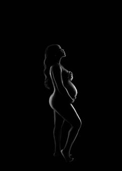 Dramatic maternity silhouette portrait captured in Orlando-FL