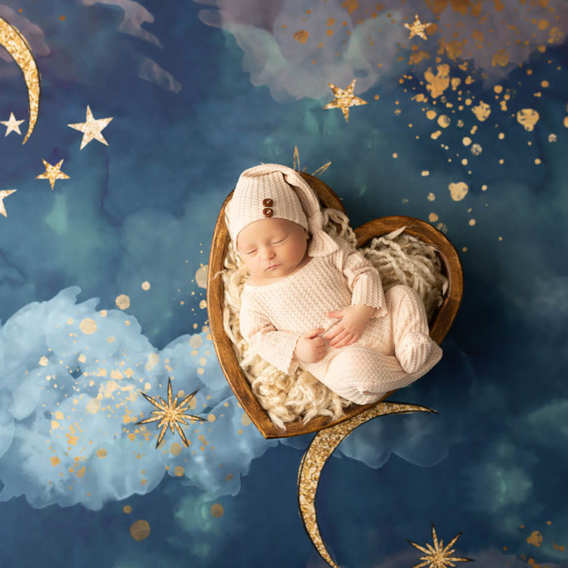 newborn baby in heart prop during Orlando newborn session