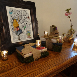 Books and custom candles on table for a party