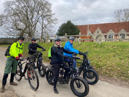 a family exploring the new forest on fat tyre e-bikes