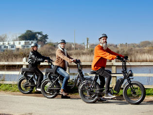 cyclists beside the sea