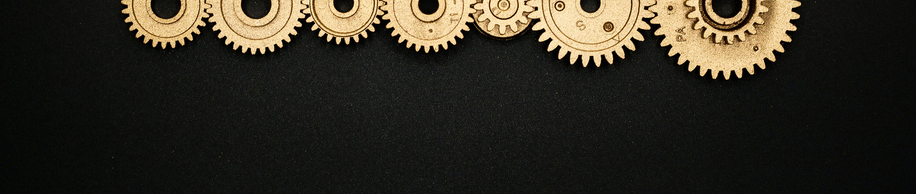 golden watch gears with a black background