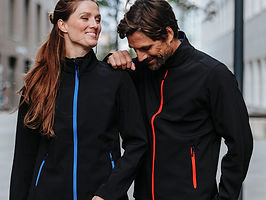 KSB-1 Stormtech jackets in a lifestyle image black with red and blue linings